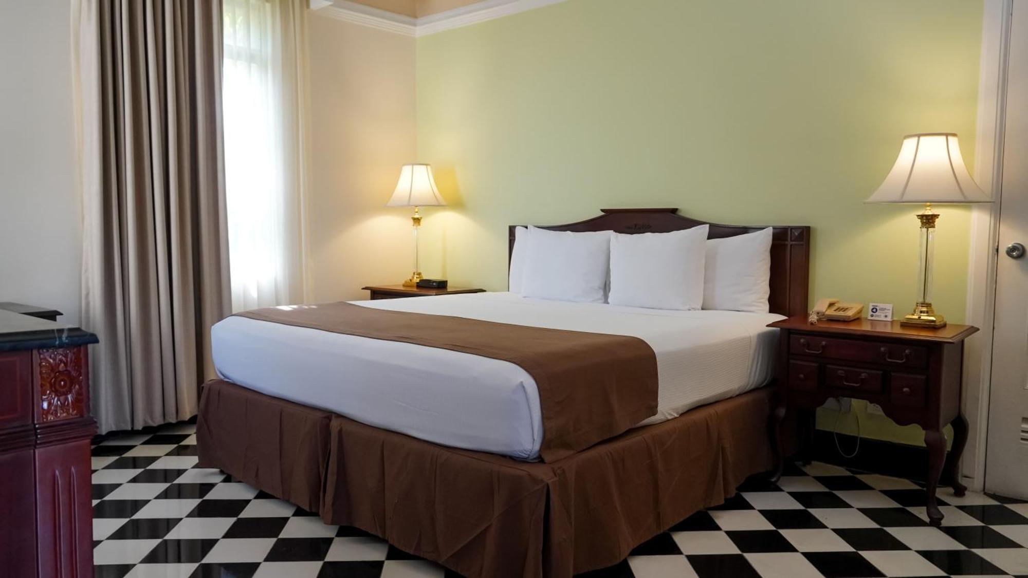 Hotel El Prado Barranquilla  Exteriör bild A bed with a bed skirt